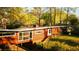 Exterior of home with a carport and hillside access featuring ample natural light and charm at 1919 Wellbourne Ne Dr, Atlanta, GA 30324