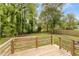 Wooden deck overlooking a spacious, private backyard with mature trees at 5429 Golfcrest Cir, Stone Mountain, GA 30088