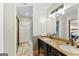 Bathroom featuring dual vanities, granite countertops, tile floors, and a walk-in shower at 5429 Golfcrest Cir, Stone Mountain, GA 30088