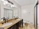 Bathroom featuring dual vanities, granite countertops, tile floors, and a walk-in shower at 5429 Golfcrest Cir, Stone Mountain, GA 30088
