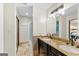 Bathroom features double vanity, granite counters and modern fixtures at 5429 Golfcrest Cir, Stone Mountain, GA 30088