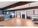 Large bedroom with exposed wooden beams, hardwood floors and modern decor at 5429 Golfcrest Cir, Stone Mountain, GA 30088