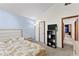 Bright bedroom with floral bedding, a built-in closet, and a charming aesthetic at 5429 Golfcrest Cir, Stone Mountain, GA 30088