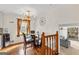 Bright dining area with modern lighting fixture and a large window overlooking the yard at 5429 Golfcrest Cir, Stone Mountain, GA 30088