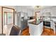 Well-equipped kitchen featuring stainless steel appliances, granite countertops, and wood floors at 5429 Golfcrest Cir, Stone Mountain, GA 30088