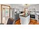 Modern kitchen featuring white cabinetry, stainless appliances, and an island at 5429 Golfcrest Cir, Stone Mountain, GA 30088