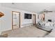Cozy living room with a comfortable sofa, TV and bright, neutral tones at 5429 Golfcrest Cir, Stone Mountain, GA 30088