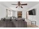Spacious living room features a stone fireplace and a large comfortable sofa at 5429 Golfcrest Cir, Stone Mountain, GA 30088