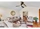 Cozy living room with hardwood floors, fireplace, and comfortable seating arrangement at 5429 Golfcrest Cir, Stone Mountain, GA 30088