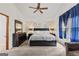 Main bedroom featuring a large bed, tasteful decor, and a comfortable seating area at 5429 Golfcrest Cir, Stone Mountain, GA 30088