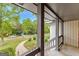 Inviting porch with view of a beautifully landscaped front yard and quiet residential street at 5429 Golfcrest Cir, Stone Mountain, GA 30088