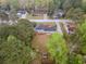 Aerial shot of a home featuring a spacious backyard, mature trees, and a peaceful setting at 1717 Ramblewood Way, Snellville, GA 30078