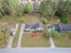 Aerial view of a beautiful home with a lush landscaped yard, mature trees, and long driveway at 1717 Ramblewood Way, Snellville, GA 30078