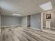 Spacious finished basement with stylish flooring, ample lighting, and neutral walls creating a versatile living area at 1717 Ramblewood Way, Snellville, GA 30078