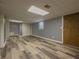 Expansive finished basement featuring stylish flooring, ample storage, and versatile space for various activities at 1717 Ramblewood Way, Snellville, GA 30078