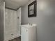 Modern bathroom featuring a new shower and vanity with updated fixtures at 1717 Ramblewood Way, Snellville, GA 30078
