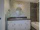 Elegant bathroom featuring a shower, and custom bird-themed wallpaper at 1717 Ramblewood Way, Snellville, GA 30078
