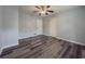 This bedroom features durable hardwood flooring and neutral paint at 1717 Ramblewood Way, Snellville, GA 30078