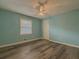 Bedroom featuring hardwood floors, and a large window at 1717 Ramblewood Way, Snellville, GA 30078