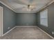 Bedroom featuring neutral carpet, light gray paint and ample natural light at 1717 Ramblewood Way, Snellville, GA 30078