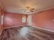 Bright bedroom featuring modern laminate floors and a ceiling fan at 1717 Ramblewood Way, Snellville, GA 30078