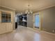Bright dining room with modern lighting, offering backyard access and kitchen views at 1717 Ramblewood Way, Snellville, GA 30078