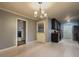 Dining room featuring a view of the kitchen and brick fireplace, complete with a chandelier at 1717 Ramblewood Way, Snellville, GA 30078
