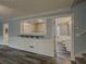 Open-concept living space with modern flooring, blue accent walls and stylish wainscoting at 1717 Ramblewood Way, Snellville, GA 30078