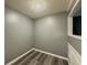An empty space with neutral walls, modern flooring and decorative molding details at 1717 Ramblewood Way, Snellville, GA 30078