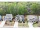 Aerial view of a neighborhood showcasing well-maintained homes, mature trees, and manicured lawns at 4421 Wooded Oaks Nw, Kennesaw, GA 30152