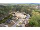 Aerial view of a suburban neighborhood featuring tree-lined streets and well-maintained homes at 4421 Wooded Oaks Nw, Kennesaw, GA 30152