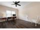 Spacious room features dark hardwood flooring, a ceiling fan and great natural light at 4421 Wooded Oaks Nw, Kennesaw, GA 30152