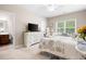 Bedroom includes a TV on the dresser and shares an entrance to the attached bathroom at 4421 Wooded Oaks Nw, Kennesaw, GA 30152