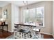 Bright dining area with modern table, chairs and pendant light, illuminated by natural light at 4421 Wooded Oaks Nw, Kennesaw, GA 30152