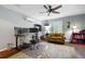 Inviting home office featuring natural light, modern fan, and ergonomic setup perfect for remote work at 4421 Wooded Oaks Nw, Kennesaw, GA 30152