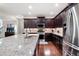 Spacious kitchen featuring stainless appliances, granite counters, and ample cabinet space at 4421 Wooded Oaks Nw, Kennesaw, GA 30152