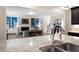 Gourmet kitchen with granite countertops, stainless steel appliances, and an open view to the living room at 4421 Wooded Oaks Nw, Kennesaw, GA 30152