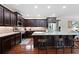 Gourmet kitchen with stainless steel appliances, granite countertops, and a center island with seating at 4421 Wooded Oaks Nw, Kennesaw, GA 30152