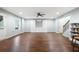 Spacious living room featuring hardwood floors, recessed lighting, and convenient access to the staircase at 4421 Wooded Oaks Nw, Kennesaw, GA 30152