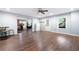 Spacious living room featuring hardwood floors, recessed lighting, and convenient access to the backyard at 4421 Wooded Oaks Nw, Kennesaw, GA 30152