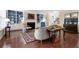 Inviting living room with custom built-ins, a fireplace, and warm, inviting decor at 4421 Wooded Oaks Nw, Kennesaw, GA 30152