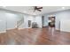 Spacious living room featuring hardwood floors, recessed lighting, and convenient access to the staircase at 4421 Wooded Oaks Nw, Kennesaw, GA 30152