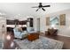 Open-concept living area seamlessly connects to kitchen, filled with natural light and stylish decor at 4421 Wooded Oaks Nw, Kennesaw, GA 30152