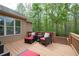 Inviting outdoor deck with comfortable seating, perfect for enjoying the surrounding nature and tranquility at 4421 Wooded Oaks Nw, Kennesaw, GA 30152