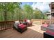 Relaxing outdoor deck with cushioned seating and views of lush greenery, perfect for entertaining at 4421 Wooded Oaks Nw, Kennesaw, GA 30152