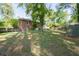 A sprawling backyard with mature trees complements this brick home creating a beautiful outdoor space at 573 Lyle Se Dr, Marietta, GA 30067