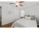 Relaxing bedroom with a ceiling fan, hardwood floors, a closet and a neutral color scheme at 573 Lyle Se Dr, Marietta, GA 30067