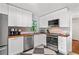 Updated kitchen featuring white cabinetry, stainless steel appliances, and butcher block countertops at 573 Lyle Se Dr, Marietta, GA 30067