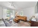 Open and airy living room filled with natural light, hardwood floors, and comfortable seating at 573 Lyle Se Dr, Marietta, GA 30067