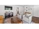 Cozy living room featuring hardwood floors, natural light, and comfortable seating arrangements at 573 Lyle Se Dr, Marietta, GA 30067